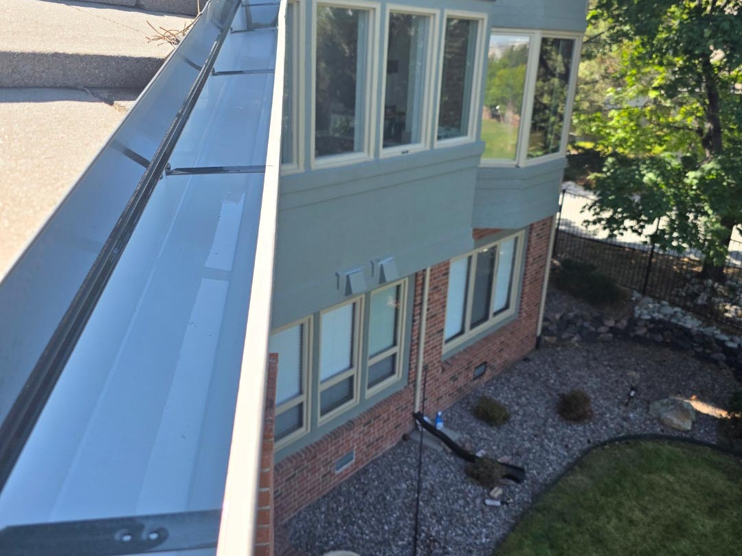 Clean gutters on a residential roof in Centennial