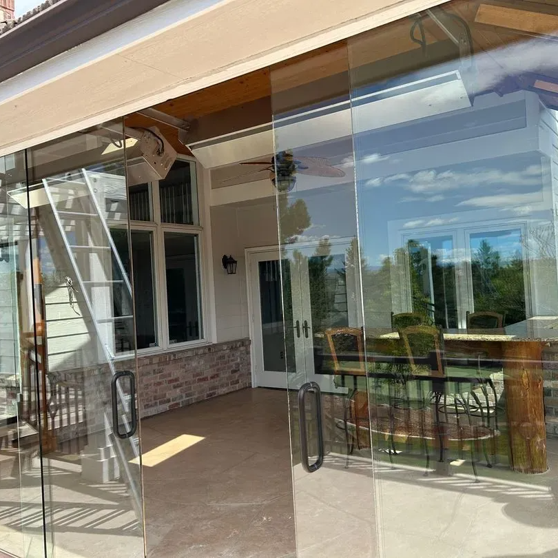 Will smiling with clean windows in the background in Highlands Ranch