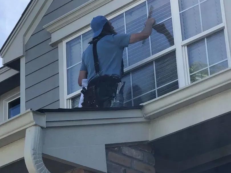 Will cleaning a large commercial window in Centennial